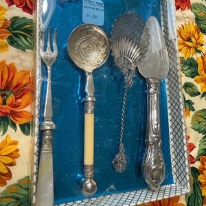 Elegant Silver and Cream Cutlery Set by David Shure